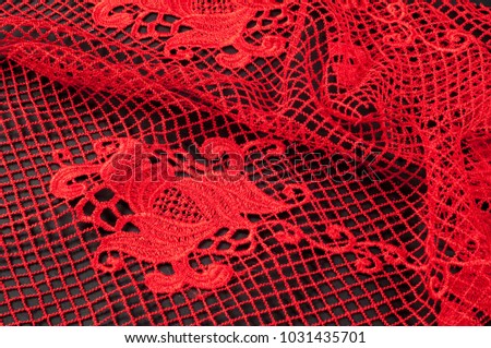 texture, pattern. fabric lace red, on a black background. A beautiful set of stripes of flowers in a thin lace, alternating between the heart contour and flash design.