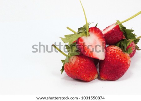  Red strawberry slice and white background Royalty-Free Stock Photo #1031550874