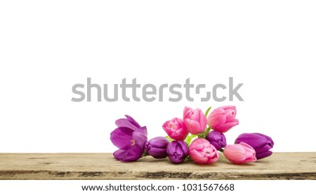 Pink and purple Tulip bouquet with green leaves isolated on white background