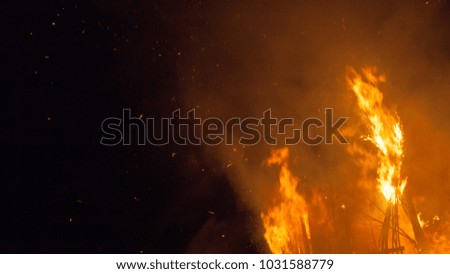 Fire. Flames on the night sky background.