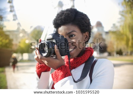 Young girl making pictures in the street