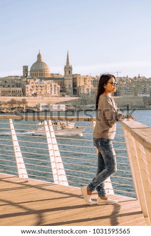 Skyline of Valletta Malta Europe, Young woman at harbor front