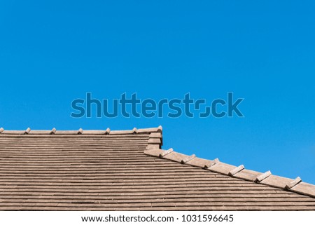 Modern tile roof with blue sky