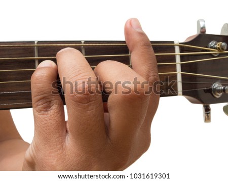 Left hand gesture "chord F" guitar chord finger position in close up isolated on white background.