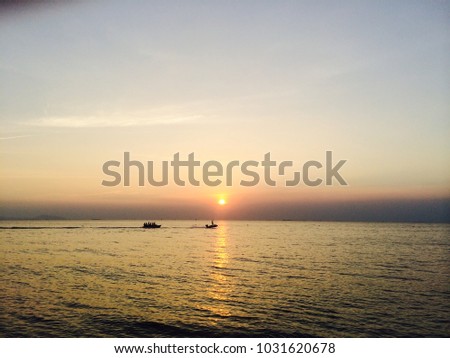 Banana Boat at the Sea at Sunset