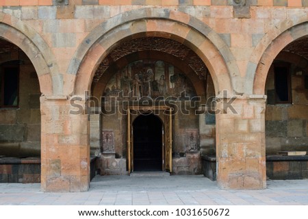entrance to the Armenian church with a picture of the saints above the door