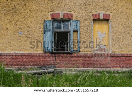 window of abandoned colorful train station