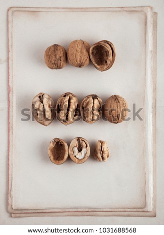 Beautifully presented walnuts on old book pages can be used as background
