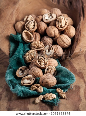 Beautifully presented walnuts on rusty wood table can be used as background