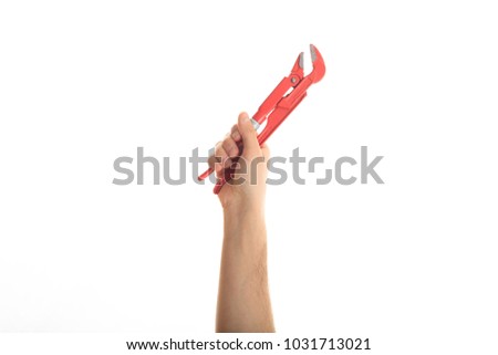 Pipe wrench. Hand holding a pipe wrench on white background