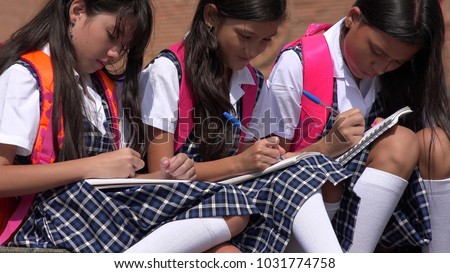 Catholic School Children Writing Wearing School Uniforms Royalty-Free Stock Photo #1031774758