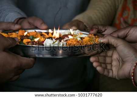 image of group of hands performing pooja during festival in India