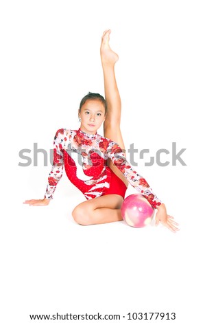 Beautiful Asian girl gymnast with a ball on white background