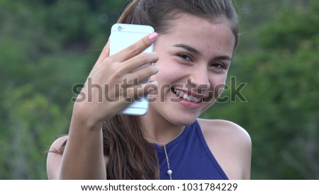 Teen Girl Taking Selfie With Cell