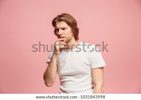 Remember all. Let me think. Doubt concept. Doubtful, thoughtful man remembering something. Young emotional man. Human emotions, facial expression concept. Studio. Isolated on trendy pink. Front