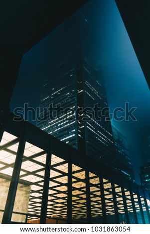 Downtown upward photo of buildings surrounded by fog