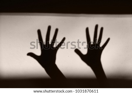 Abstract Background. Black Shadow Of A Big Hand On The Wall. Silhouette Of A Hand On The Wall. Nightmares in Children. Scary Dreams.