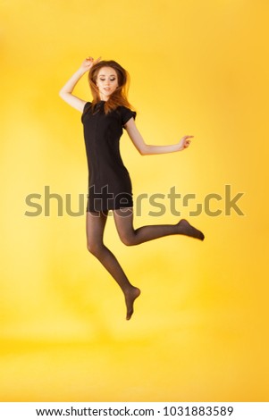 cheerful attractive girl in black. portrait