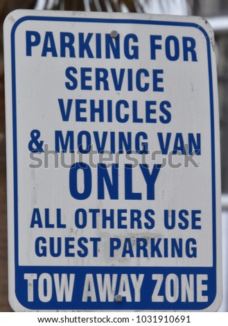 Parking for service vehicles and moving vans only sign