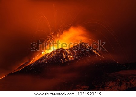 Volcano eruption landscape at night - Mount Etna in Sicily Royalty-Free Stock Photo #1031929519