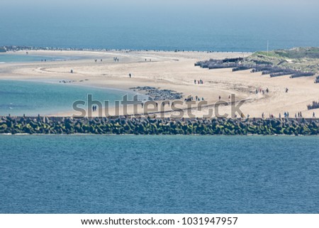 Aerial view German island Dune in the Northsea opposite of Helgoland. People are photographing seals resting at the beach