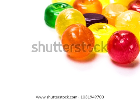 Beautiful colorful and delicious candy sweets and jelly marshmallows. Different shapes and composition lollipops marmalade isolated on abstract blurred white background. Ð¡loseup. Soft selective focus