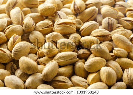 Pistachio nuts. A close-up photograph. Unrefined whole kernel