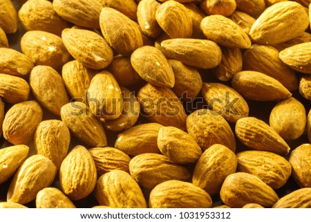 Almonds nuts. A close-up photograph. Unrefined whole kernel