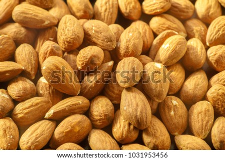 Almonds nuts. A close-up photograph. Unrefined whole kernel
