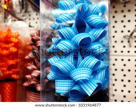 Spot rolls and artificial flower to decorate the gift box on store shelves