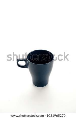 A tea cup or mug in blue over white background