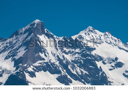 Spectacular view of the mountain Jungfrau and the four thousand meter peaks in the Bernese Alps from Greendeltwald valley, Switzerland Royalty-Free Stock Photo #1032006883