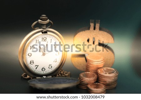 Pocket watch and stack of coins, wooden dollar with copy space using as background sale, buy, trade, business time concept.