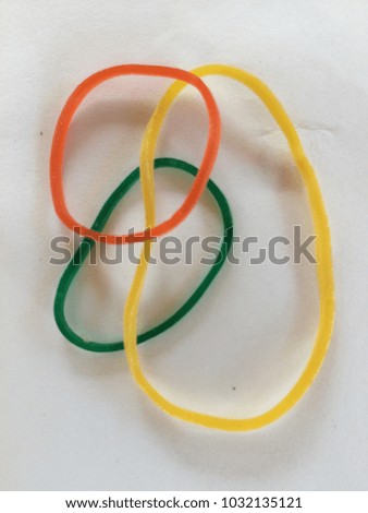 COLORFUL ELASTIC RUBBER BAND , ISOLATED WHITE BACKGROUND