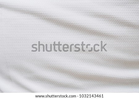 White football jersey clothing fabric texture sports wear background, close up Royalty-Free Stock Photo #1032143461