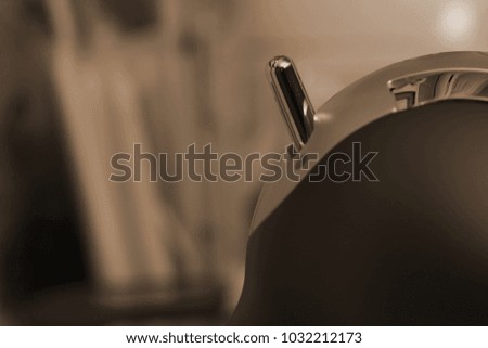 Coffee maker pull handle knob scene.