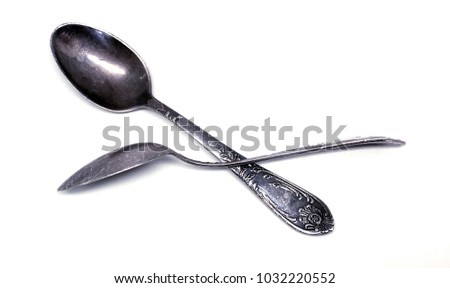 Silver spoon.Spoon for the newborn.An ancient spoon.Darkened silver.Royal silver.Silver plate.isolated white background.