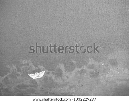 Background and Texture - Paper white boat on the grey wall and water stain with copy space