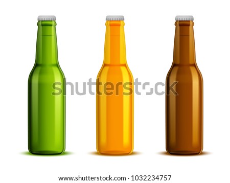 A set of three bottles of glass for beer, different colors of green, yellow and brown.