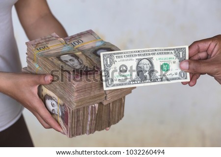 Due to the economic crisis and hyperinflation in Venezuela, the unofficial dollar exchange rate reaches 250,000 bolivars for one dollar. There is a large shortage of cash in the country Royalty-Free Stock Photo #1032260494