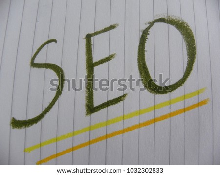 Text SEO hand written by colorful oil pastels on notebook paper
