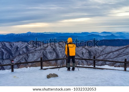Man photographer on deokyusan mountain muju ski resort south korea