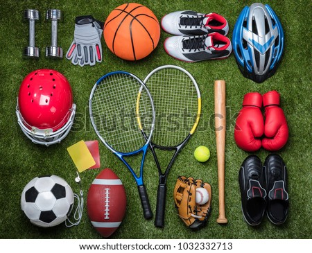 High Angle View Of Various Sport Equipments On Green Grass Royalty-Free Stock Photo #1032332713