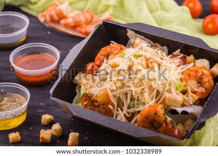 Caesar the tiger shrimps salad, the fried croutons, lettuce leaves, tomatoes sprinkled cheese
