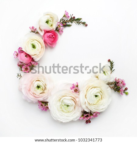 Floral round frame with ranunculus flowers, flat lay, top view with copy space