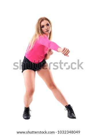 Bent choreography pose of blonde woman dancing jazz dance looking at camera. Full body length portrait isolated on white studio background.