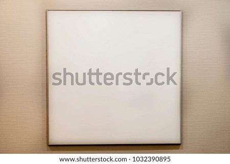 A White frame on the white wall.