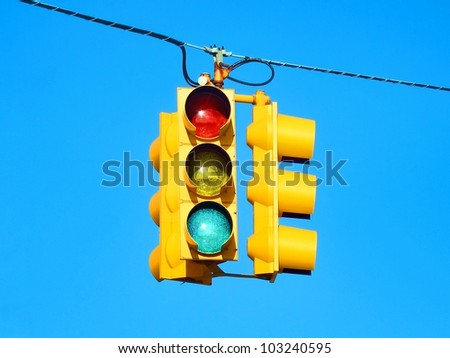 American yellow traffic lights isolated on blue sky