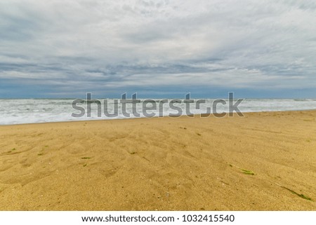 Sea waves and sand beach for texture or background. The flow of water