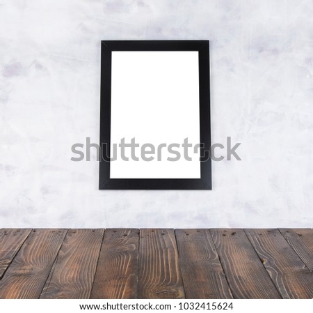Blank black picture frame  and wooden floor and grunge background